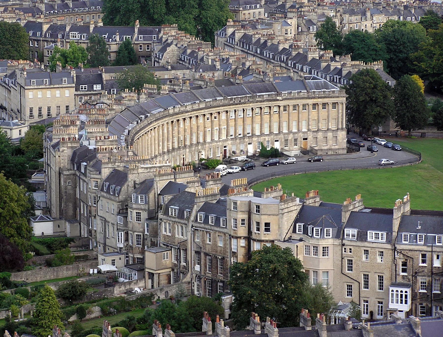 An aerial view of Bath's Royal Crescent curving through the city, a classic first stop on a weekend visit
