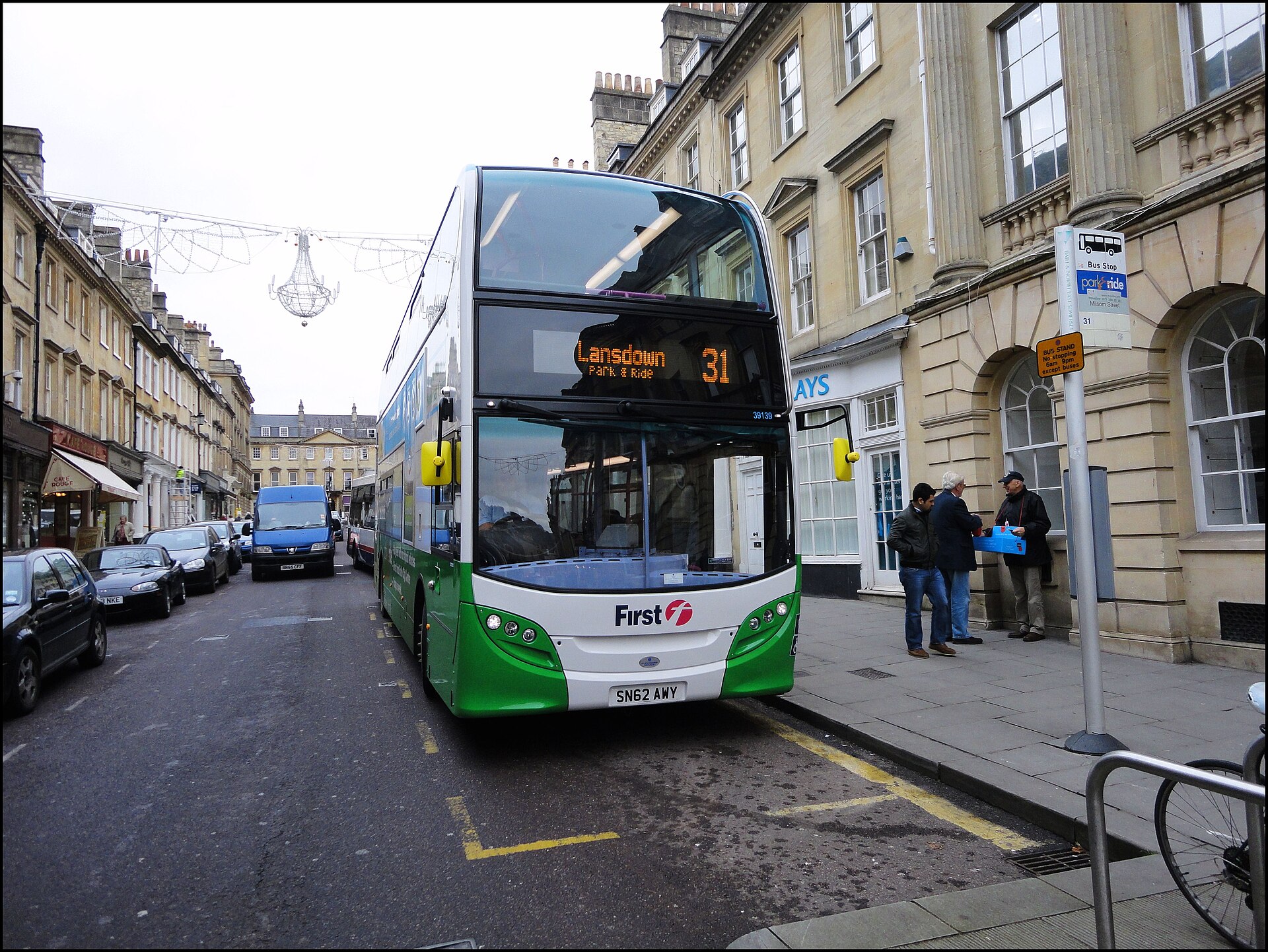 A First Bus 'Lansdown Park & Ride' double-decker picking up passengers on a Bath street