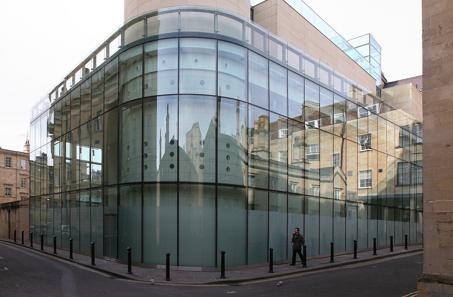 Thermae Bath Spa's modern glass exterior in central Bath, distinct from the ancient Roman Baths next door