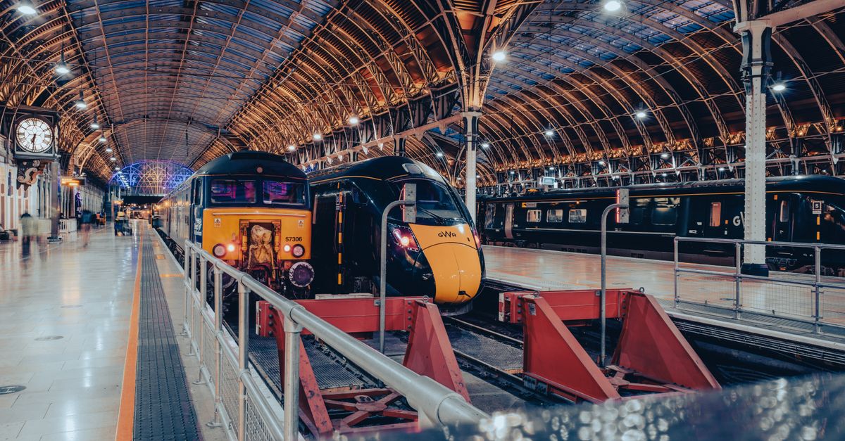GWR trains at Paddington station under the historic curved glass-and-iron roof.